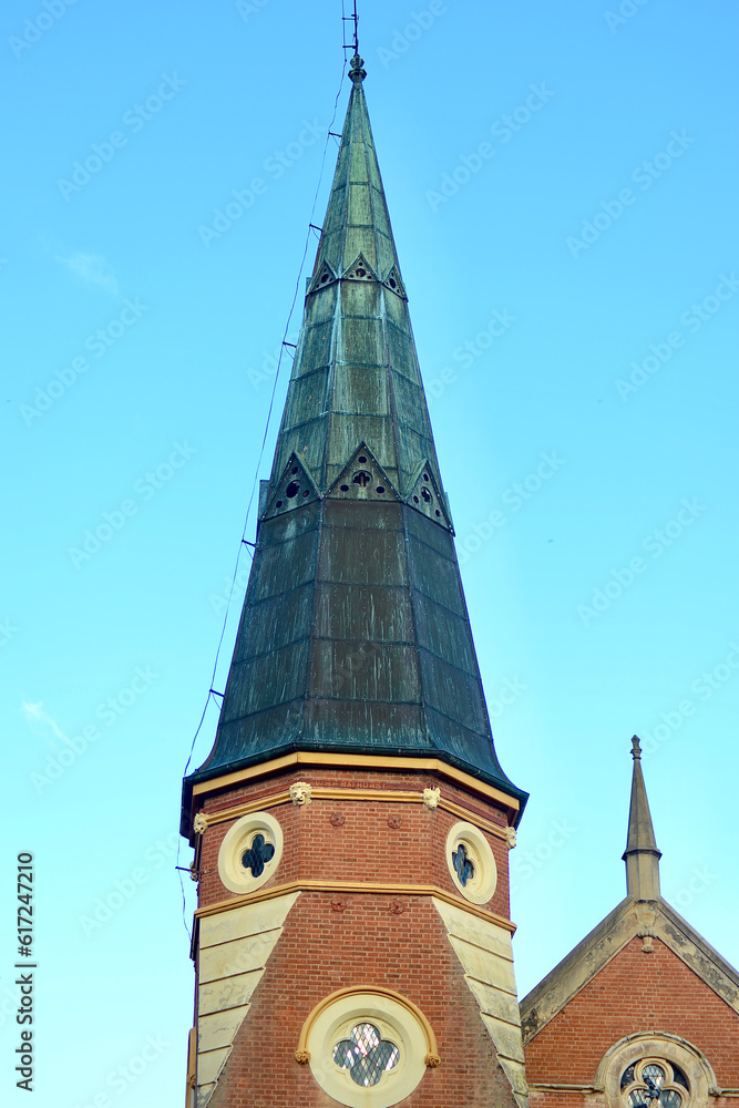 A view of the spire on a church in the city A view of the spire on a church in the city