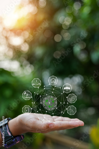 Technology, hand holding with environment Icons over the Network connection on green background.