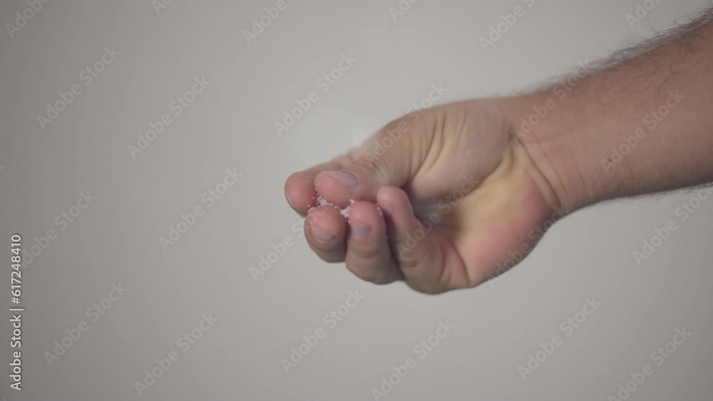 Man hands seasoning with salt bottom view Man hands seasoning with salt bottom view