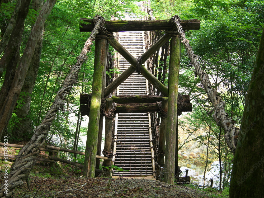 Tokushima, Japan - June 25, 2023: Oku-Iya double vine bridge or Oku-Iya Nijuu Kazura bridge. A suspension bridge made of the plant called Shirakuchikazura.
Tokushima, Japan - June 25, 2023: Oku-Iya double vine bridge or Oku-Iya Nijuu Kazura bridge. A suspension bridge made of the plant called Shirakuchikazura.