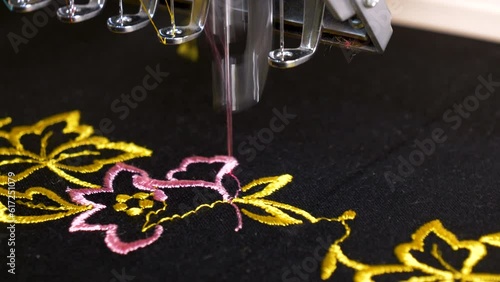 Traditional motifs embroidered on fabric by machine. Crafts with an impressive appearance and made with colorful threads. photo