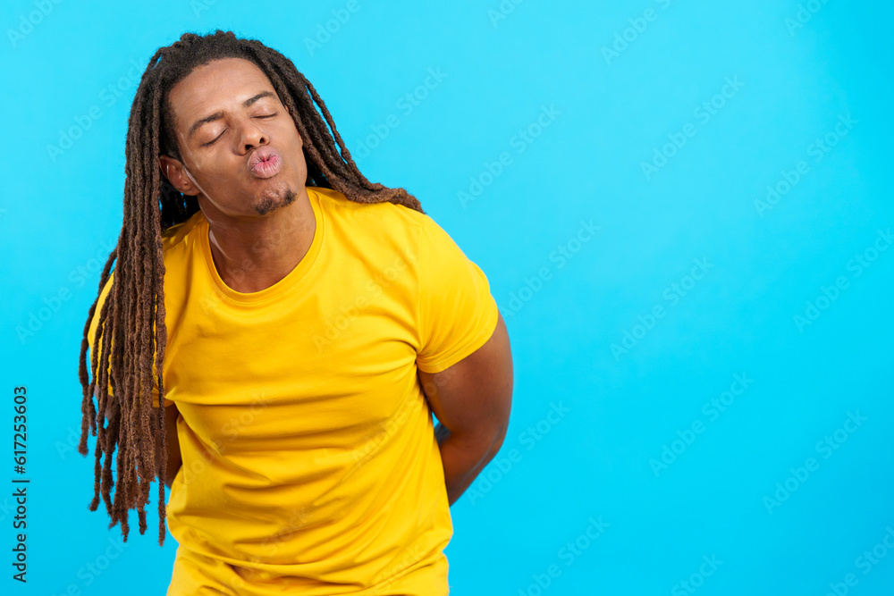 Latin man with dreadlocks kissing with eyes closed Latin man with dreadlocks kissing with eyes closed
