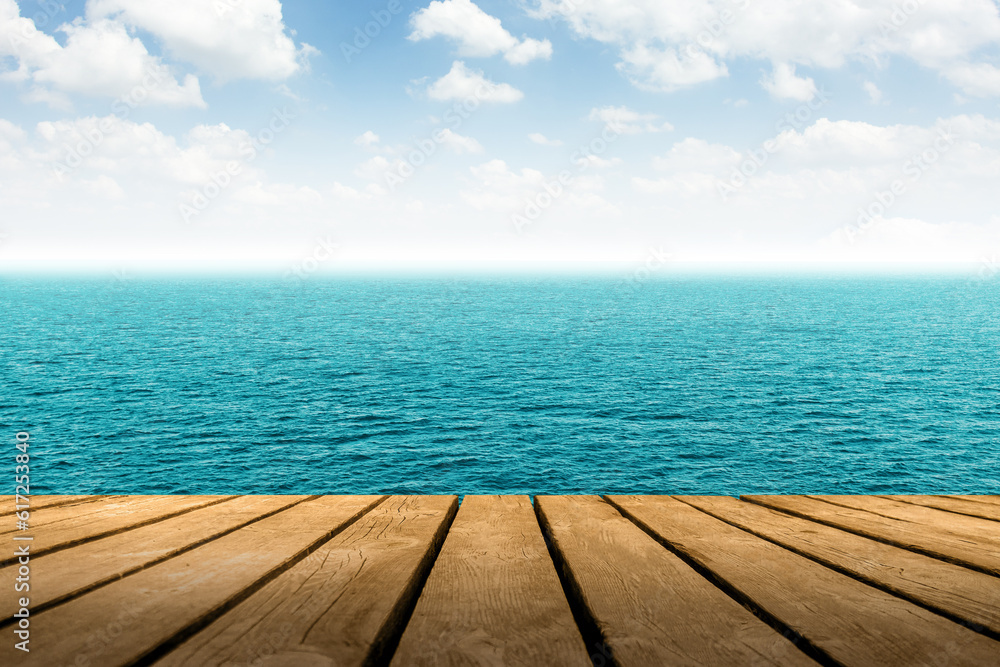 Summer travel landscape view of blue Sea with wooden plank to place products Summer travel landscape view of blue Sea with wooden plank to place products