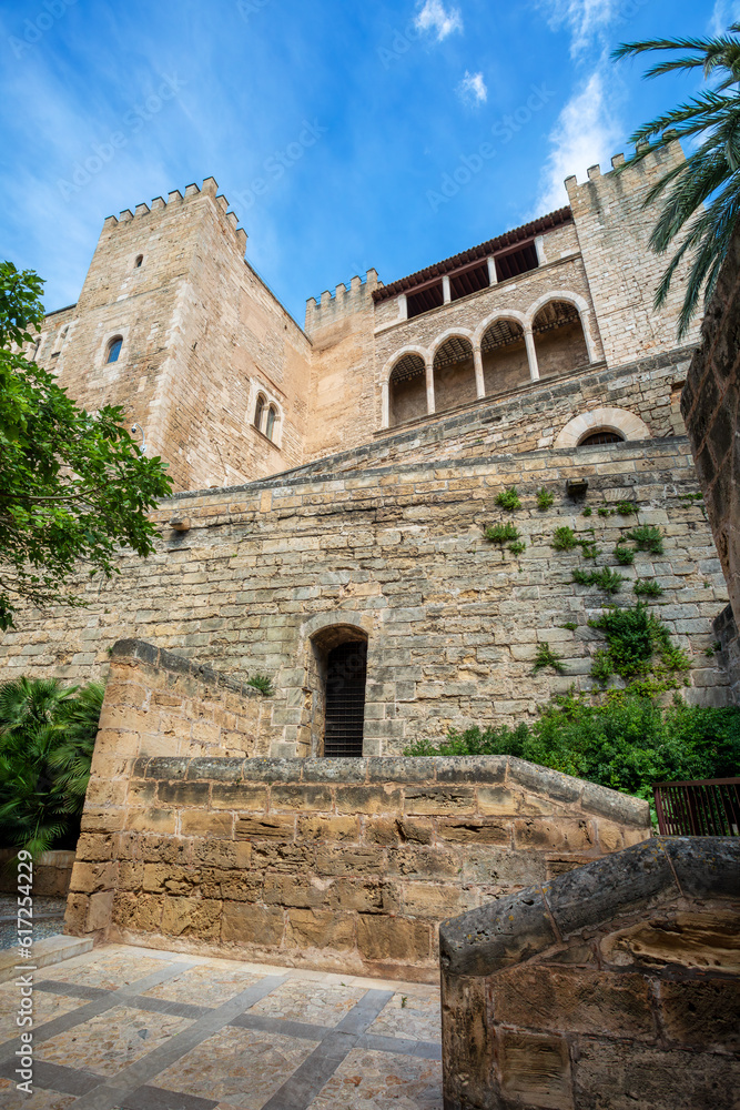 Royal Palace of La Almudaina next to cathedral La Seu. One of the official residences of the Spanish royal family. City Palma de Mallorca. Balearic Islands Spain. Travel agency vacation concept. Royal Palace of La Almudaina next to cathedral La Seu. One of the official residences of the Spanish royal family. City Palma de Mallorca. Balearic Islands Spain. Travel agency vacation concept.