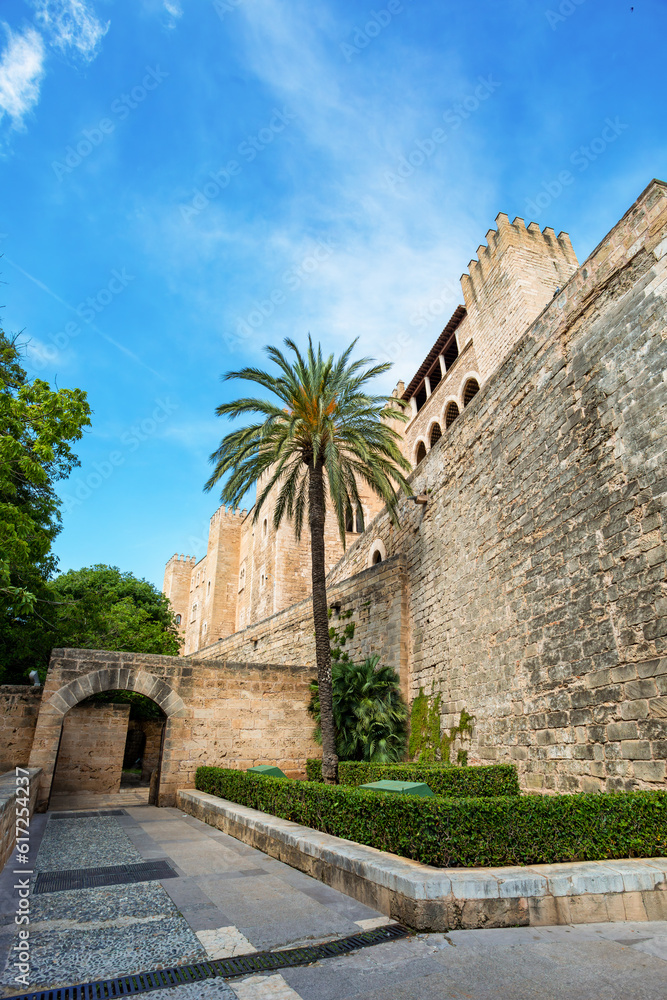 Royal Palace of La Almudaina next to cathedral La Seu. One of the official residences of the Spanish royal family. City Palma de Mallorca. Balearic Islands Spain. Travel agency vacation concept.