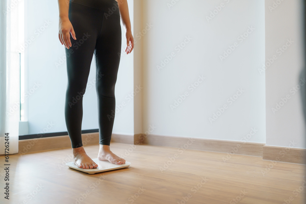 Lose weight. Fat diet and scale feet standing on electronic scales for weight control. Measurement instrument in kilogram for diet. Lose weight. Fat diet and scale feet standing on electronic scales for weight control. Measurement instrument in kilogram for diet.