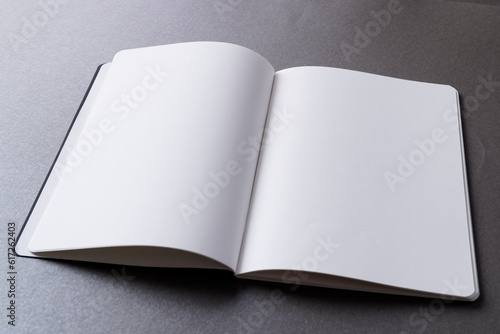 Close up of open book with copy space on grey background