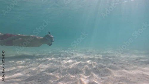 Wallpaper Mural underwater man snorkeling in the sea withcrystal-clear waters of a beach concept of holiday relax summer beach diver in the sea	 Torontodigital.ca