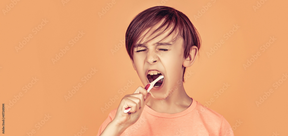 Little boy cleaning teeth with kids toothbrush. Happy child kid boy with toothbrush. Health care, dental hygiene Little boy cleaning teeth with kids toothbrush. Happy child kid boy with toothbrush. Health care, dental hygiene