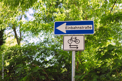 One-way street sign and cyclist free sign