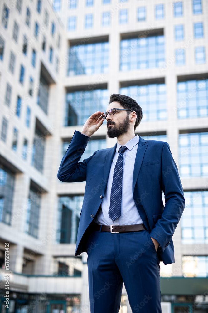 A young perspective businessman in a smart outfit and business outdoor A young perspective businessman in a smart outfit and business outdoor