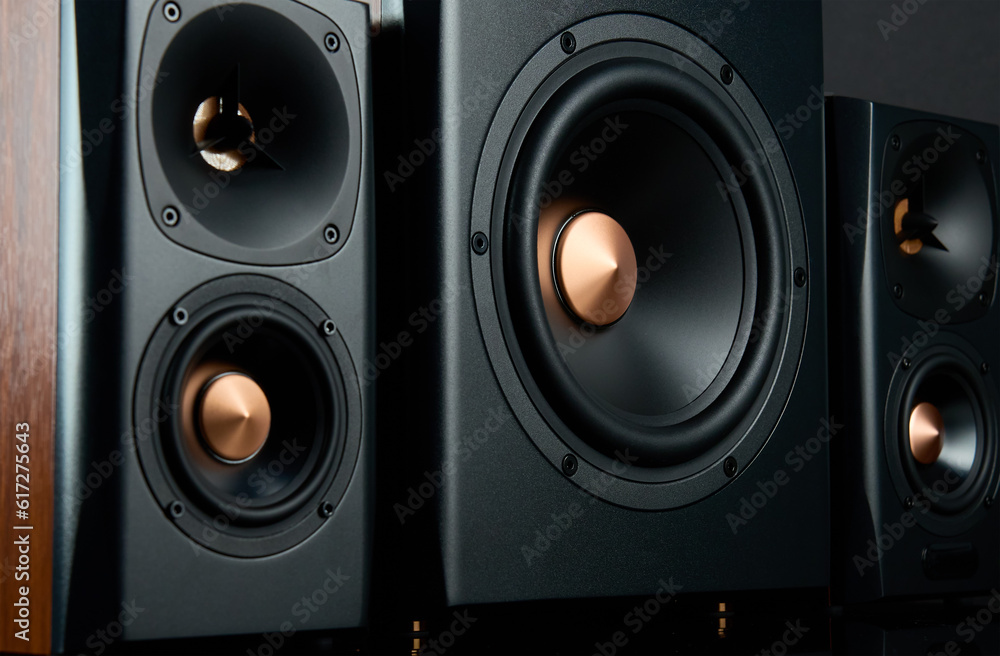 Multimedia acoustic sound speakers. Sound audio system with two satellites and subwoofer on dark background. Stereo system for listening music Multimedia acoustic sound speakers. Sound audio system with two satellites and subwoofer on dark background. Stereo system for listening music