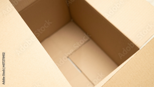 open cardboard boxes close-up, cutout for handle in cardboard box