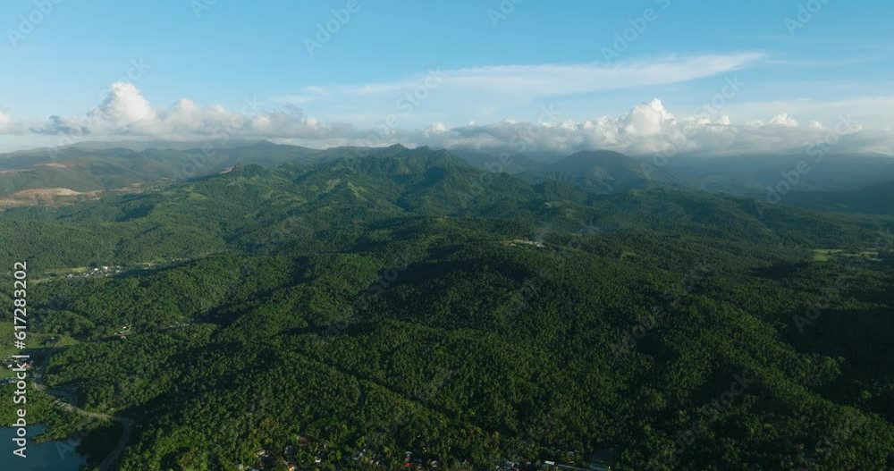 Beautiful mountain view of tropical island. Clear blue skies and clouds. Mindanao, Philippines. Beautiful mountain view of tropical island. Clear blue skies and clouds. Mindanao, Philippines.