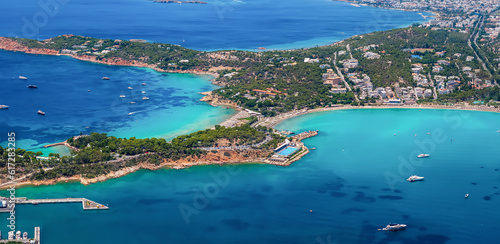 Aerial view of the famous Astir luxury retreat beach at the Vouliagmeni district of Athens, Greece, with turquoise shining sea