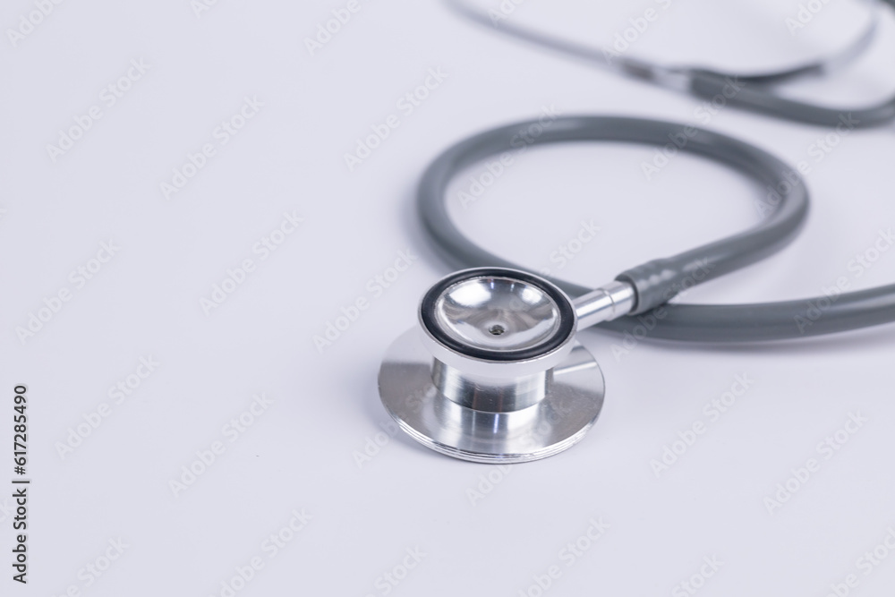 Closeup doctor's stethoscope on white table for medical nursing people check up healing of patients in hospital. healthcare concept. Closeup doctor's stethoscope on white table for medical nursing people check up healing of patients in hospital. healthcare concept.