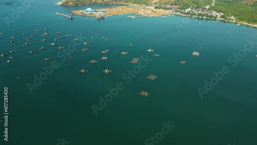 Lobster aquaculture in marine pens, Awang fishing harbor, Mertak. Wide aerial photo