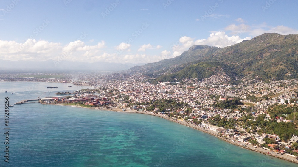 An Aerial, High-Altitude, Overwater View of Cap-Haitien, Haiti and Surrounding Mountains