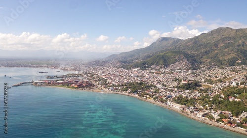 Bild auf Leinwand An Aerial, High-Altitude, Overwater View of Cap-Haitien, Haiti and Surrounding M