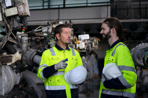 Engineer work at robotic arm factory.