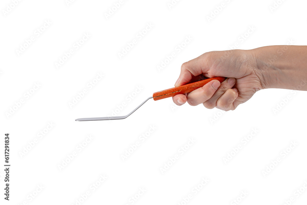 Pastry spatula in hand on transparent background isolation