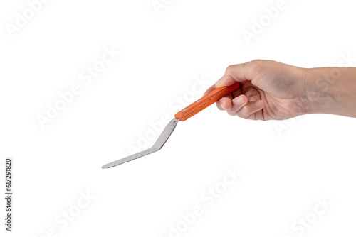 Pastry spatula in hand on transparent background isolation