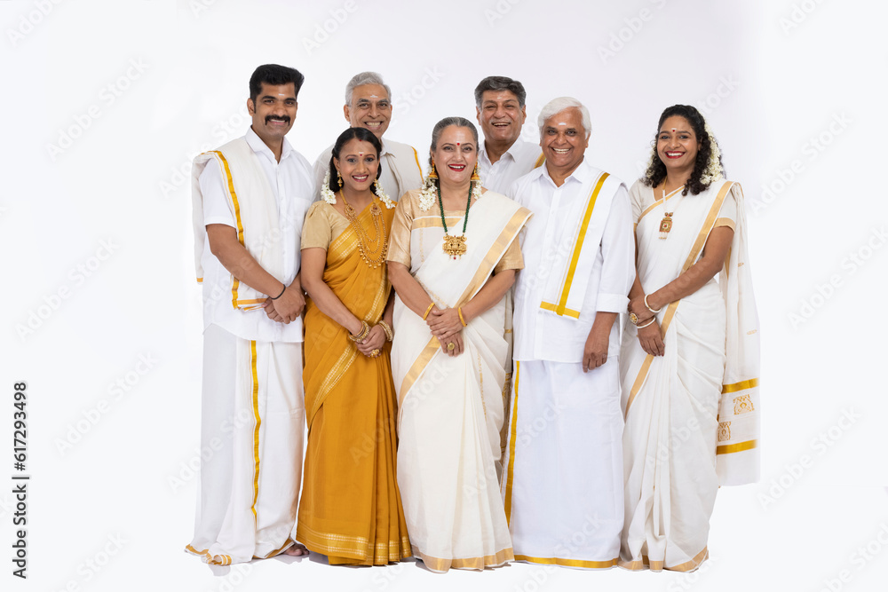 South indian family in traditional clothing isolated on white background.