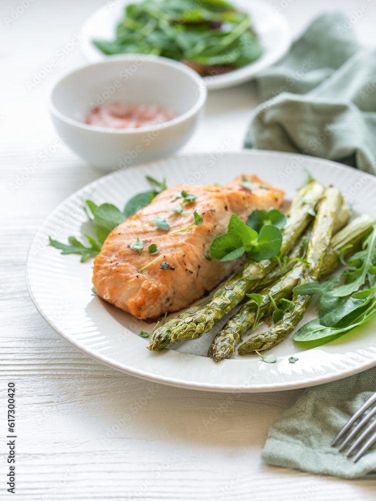 Baked Delicious salmon, green asparagus on plate Baked Delicious salmon, green asparagus on plate