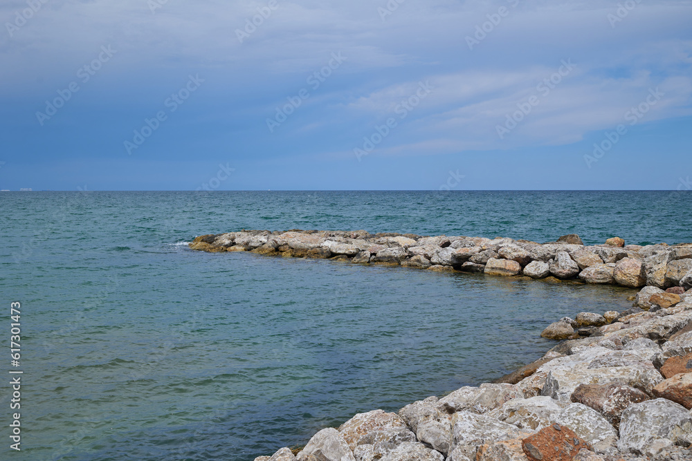 Sea stone breakwater.