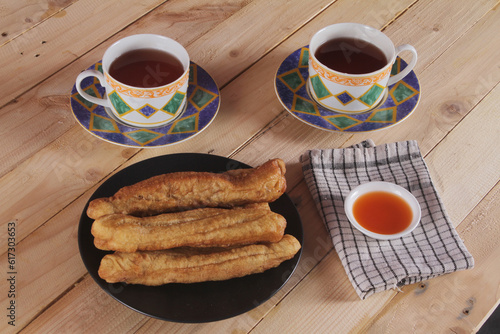 A plate of Cakwe or Cakue. Cakwe is one of the traditional Chinese snacks with a savory taste
 photo