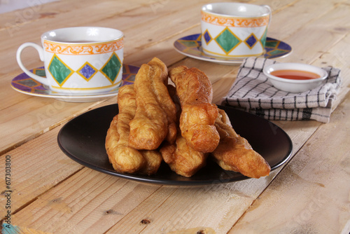 A plate of Cakwe or Cakue. Cakwe is one of the traditional Chinese snacks with a savory taste
 photo