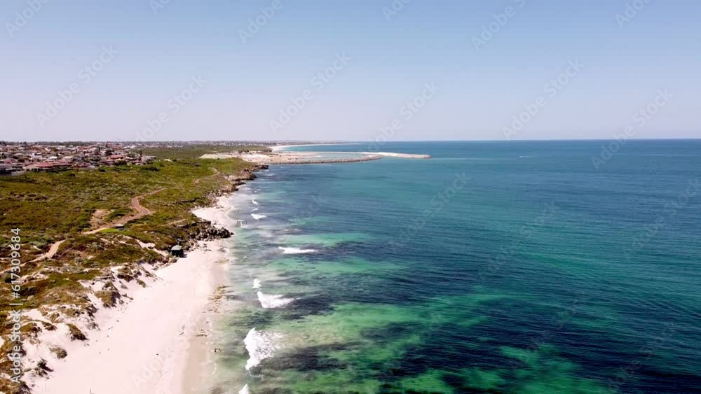 People enjoying the white sand and deep blue sea at Ocean Reef, aerial People enjoying the white sand and deep blue sea at Ocean Reef, aerial