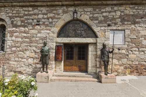 Ruzica church at Belgrade fortress, Kalemegdan. At the entrance to the church, there are 2 bronze sculptures - a Serbian medieval knight and a Serbian warrior from the wars of liberation. photo