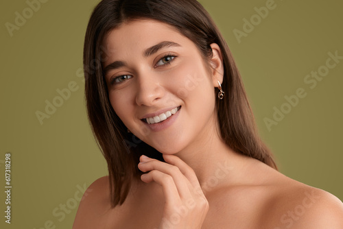 Charming young woman with flawless skin