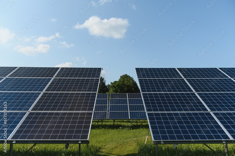 Solar panels and blue sky. Solar panels system power generators from sun. Clean technology for better future Solar panels and blue sky. Solar panels system power generators from sun. Clean technology for better future