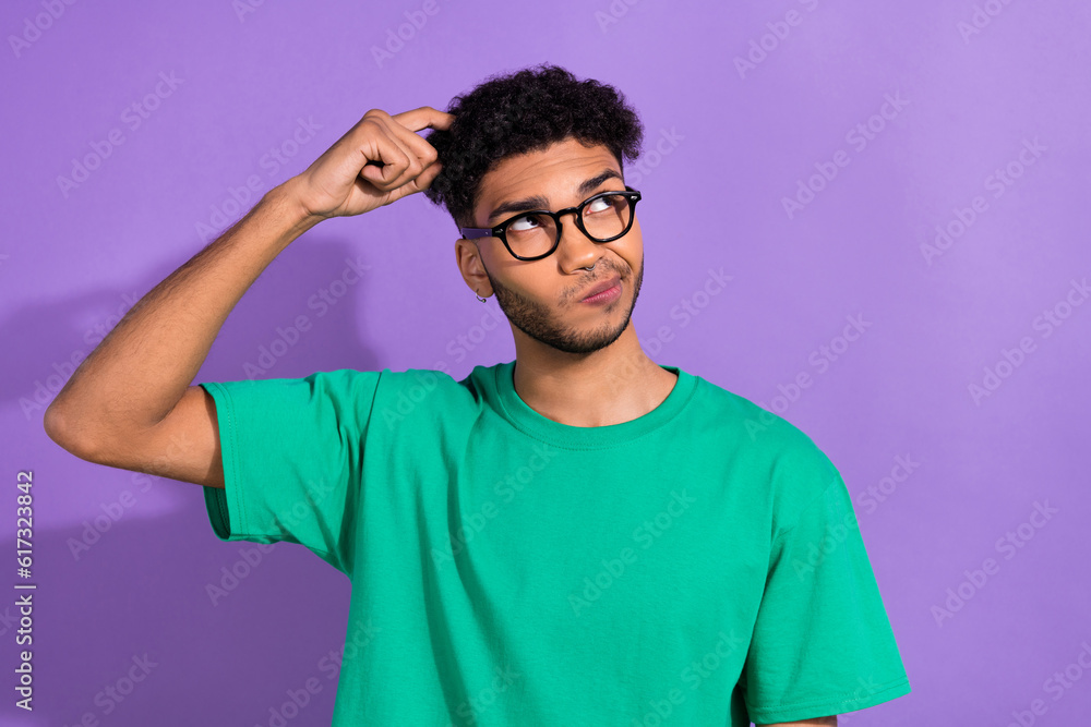 Photo of minded uncertain person finger scratch head look empty space isolated on violet color background Photo of minded uncertain person finger scratch head look empty space isolated on violet color background