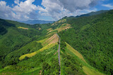 Aerial view of Beautiful blue sky and road over top of mountains, Nan province, Thailand.