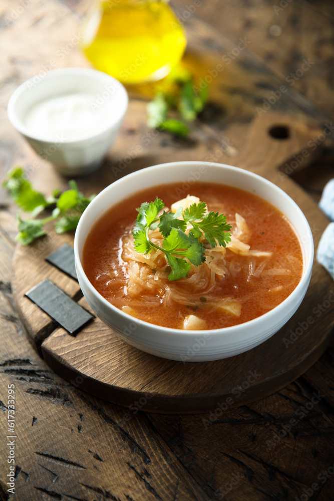 Traditional homemade sauerkraut soup with fresh parsley Traditional homemade sauerkraut soup with fresh parsley