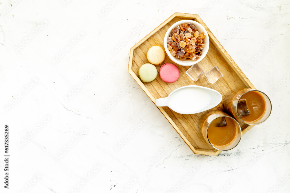 Two glasses of cold iced coffee with macaroons for summer breakfast Two glasses of cold iced coffee with macaroons for summer breakfast