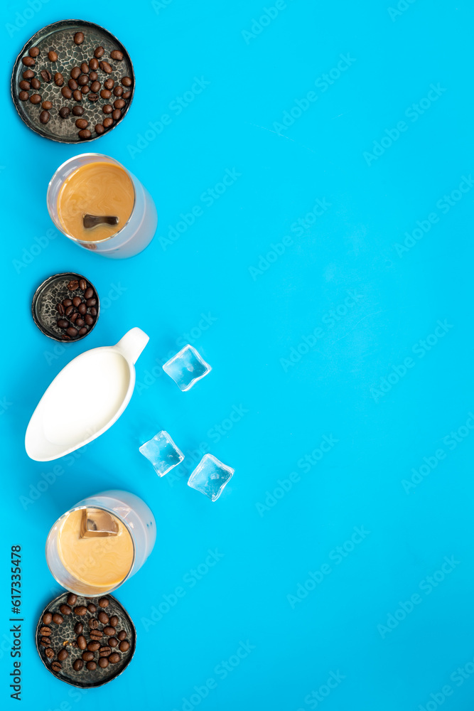 Top view of cold latte coffee with ice and coffee beans Top view of cold latte coffee with ice and coffee beans