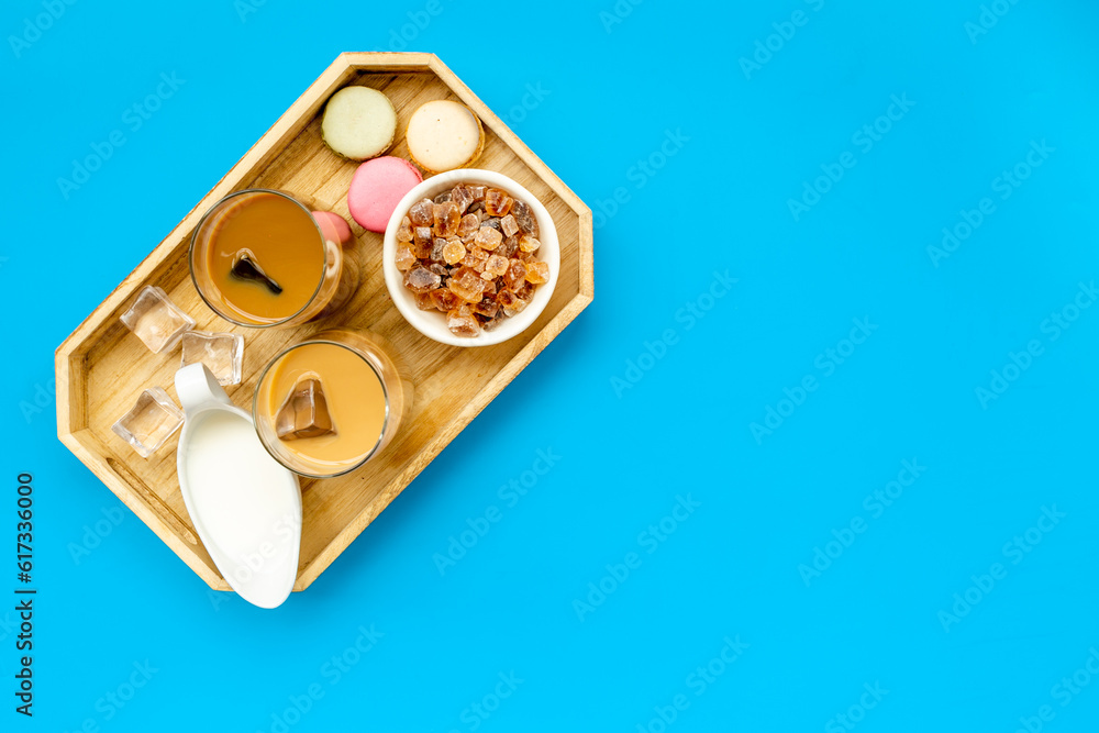 Two glasses of cold iced coffee with macaroons for summer breakfast Two glasses of cold iced coffee with macaroons for summer breakfast