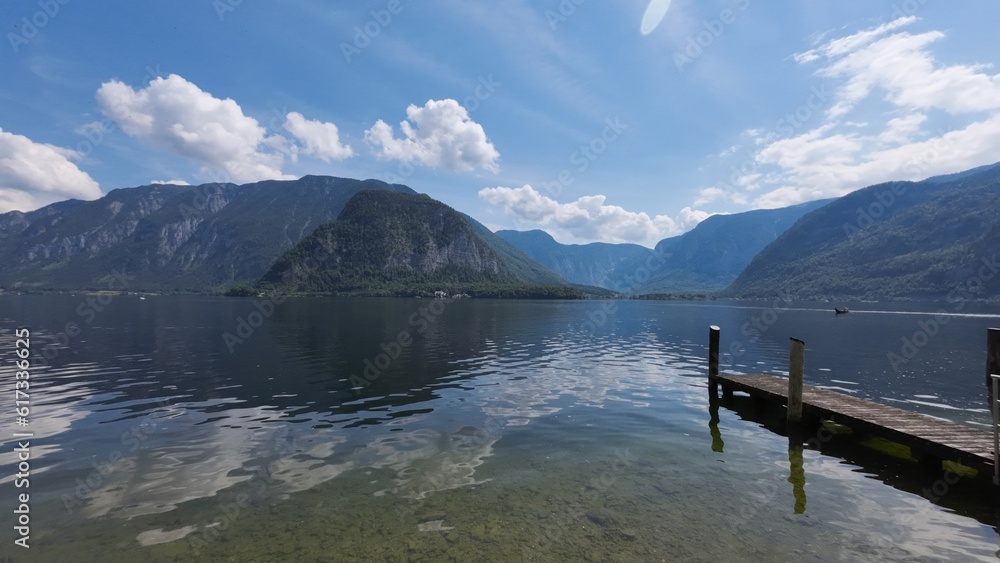 Lake, mountain, blue sky clouds: amazing landscape in Hallstatt town, Austria Lake, mountain, blue sky clouds: amazing landscape in Hallstatt town, Austria