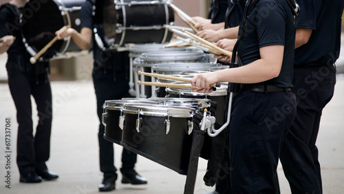 marching band drum line warming up for a parade