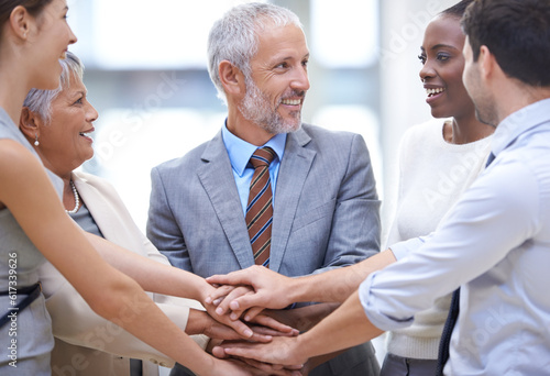 Business people, group and hands together for teamwork cooperation and solidarity. Collaboration, smile and community huddle of employees for support, mission and motivation for goals in partnership. © Arcurs Corp/peopleimages.com