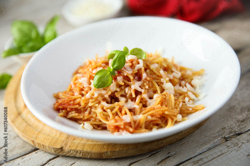 Homemade pasta with tomato and cheese