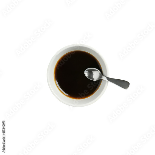 The image is an up-close shot of a cup of espresso coffee, placed on a table.