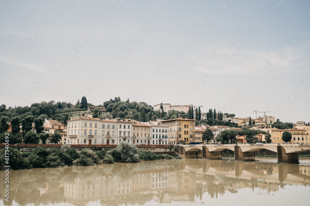 A view of the glassy Arno river