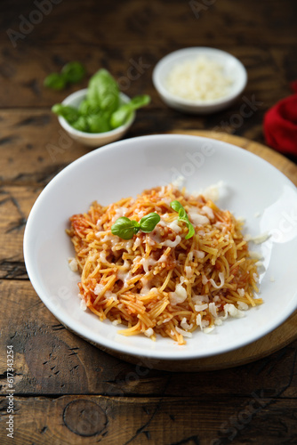 Homemade pasta with tomato and cheese