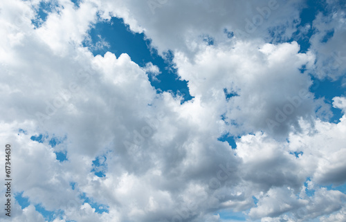 Blue sky with cumulus clouds during summer. Wheater, meteorology, atmosphere and overcast.