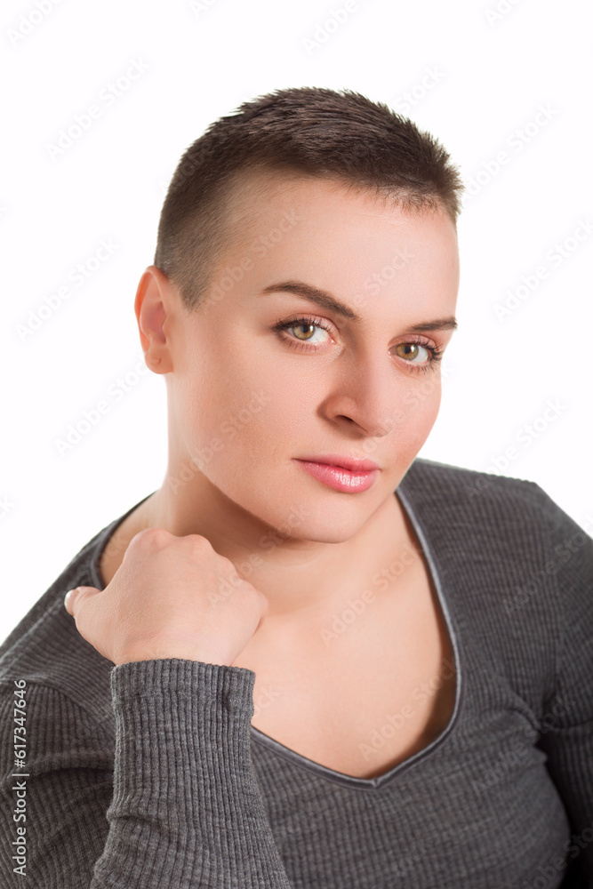A portrait of a beautiful woman in short black hair against white background. A portrait of a beautiful woman in short black hair against white background.